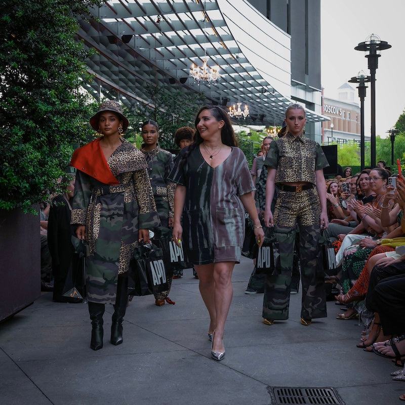 Amy Page DeBlasio the designer walking the runway with her models