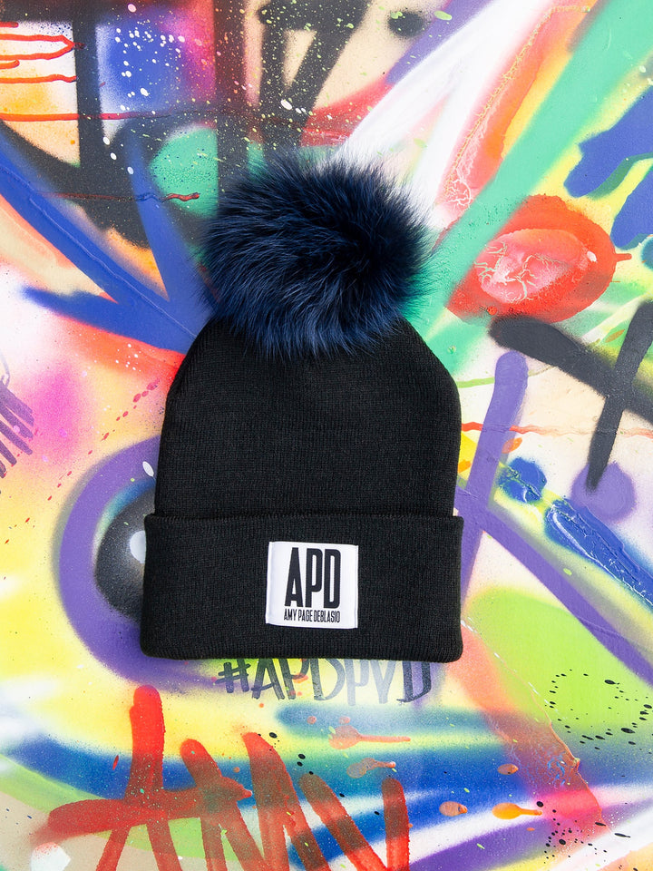 Amy Page DeBlasio Hats Black with dark blue pom pom and logo tag Beanie with Fur Pom Pom