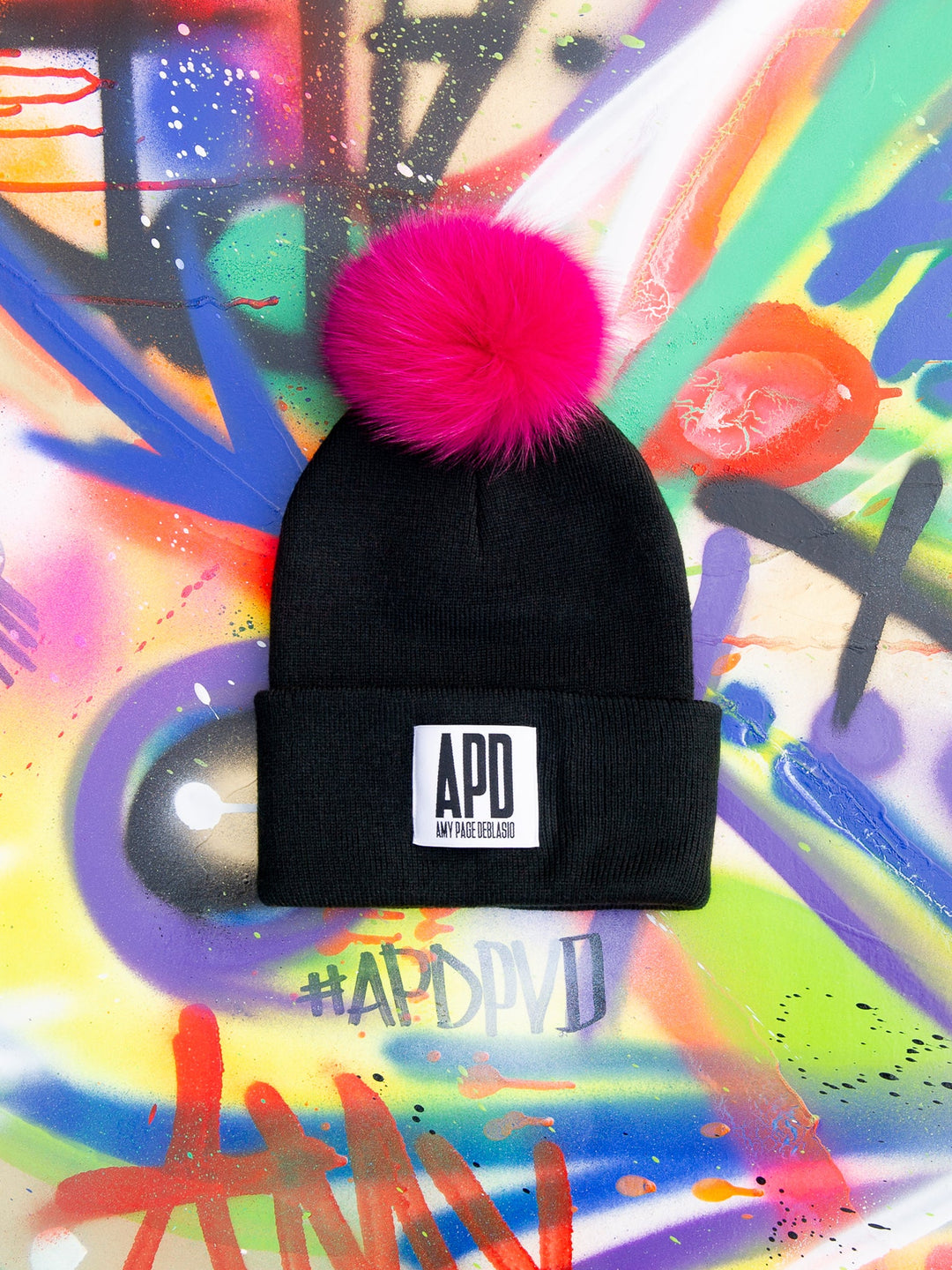 Amy Page DeBlasio Hats Black with hot pink pom pom and logo tag Beanie with Fur Pom Pom